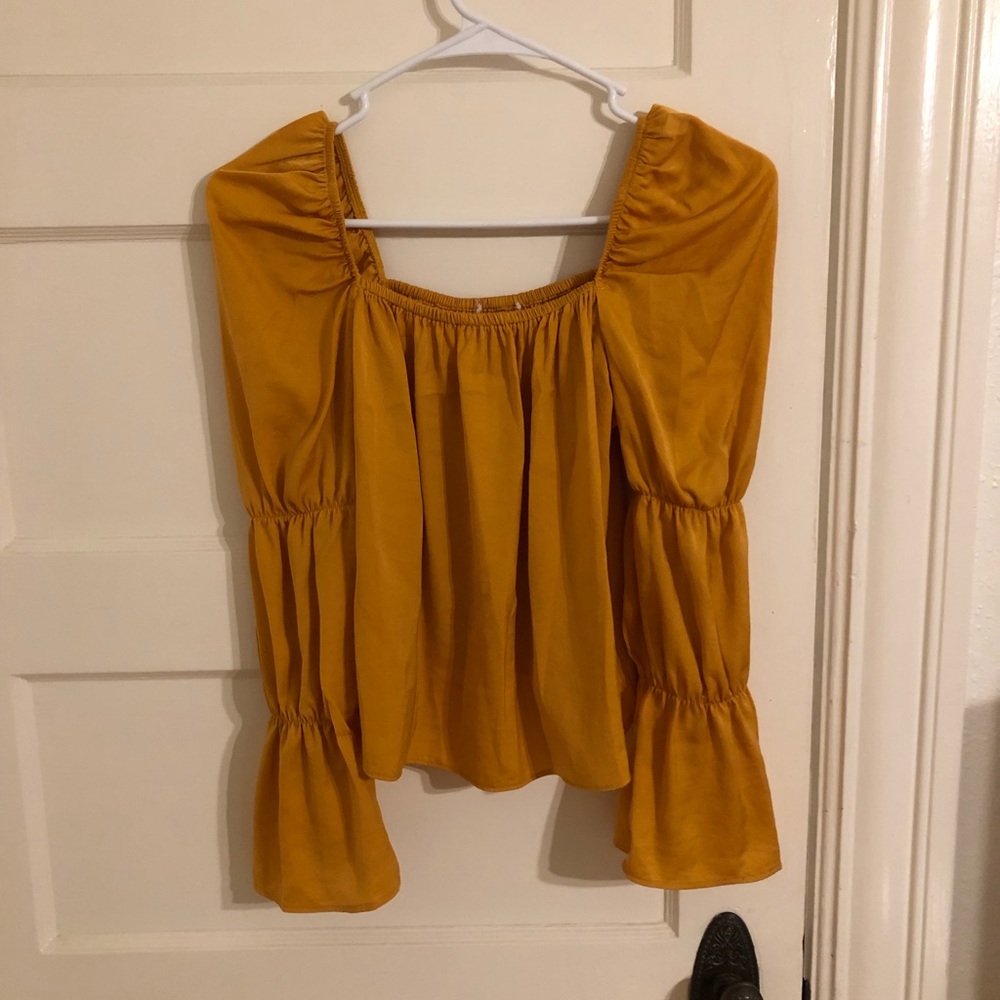 Mustard yellow silky top.